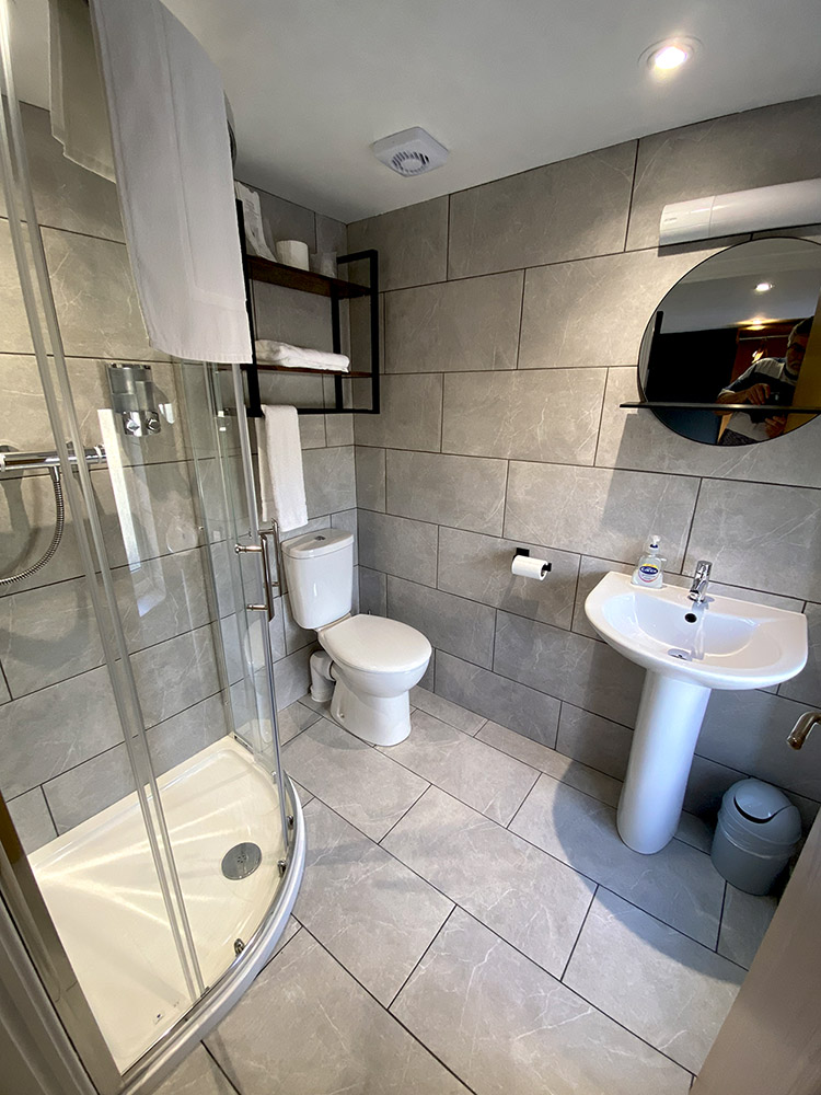 Tiled bathroom with shower cubicle