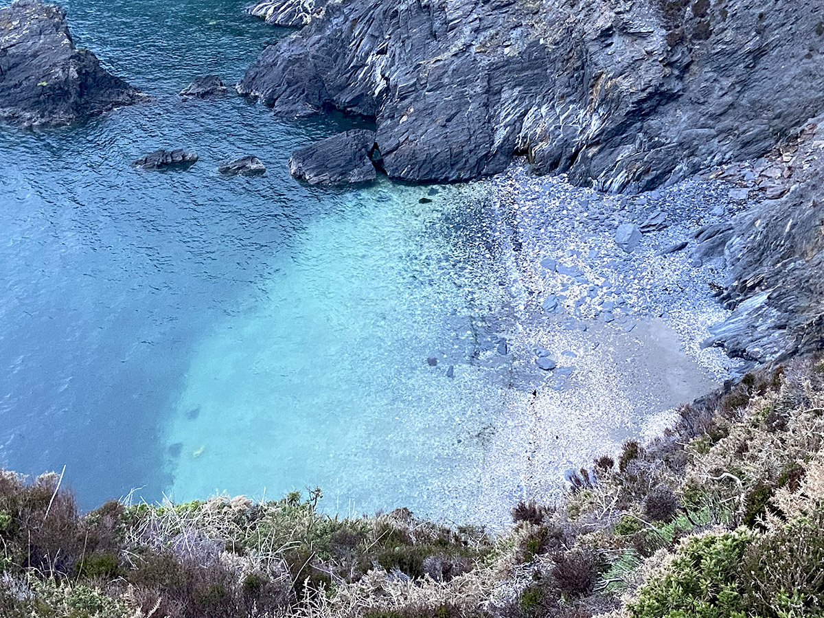 Turquoise and indigo pool from the coastal path